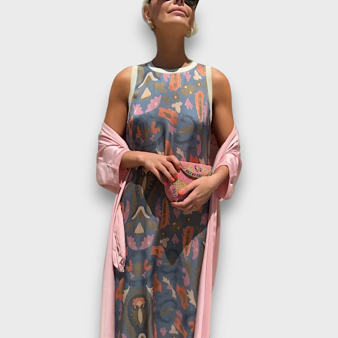 Elveria - Maxi suknelė su kardiganu" can be rewritten as "Elveria - Maxi Dress with Cardigan.