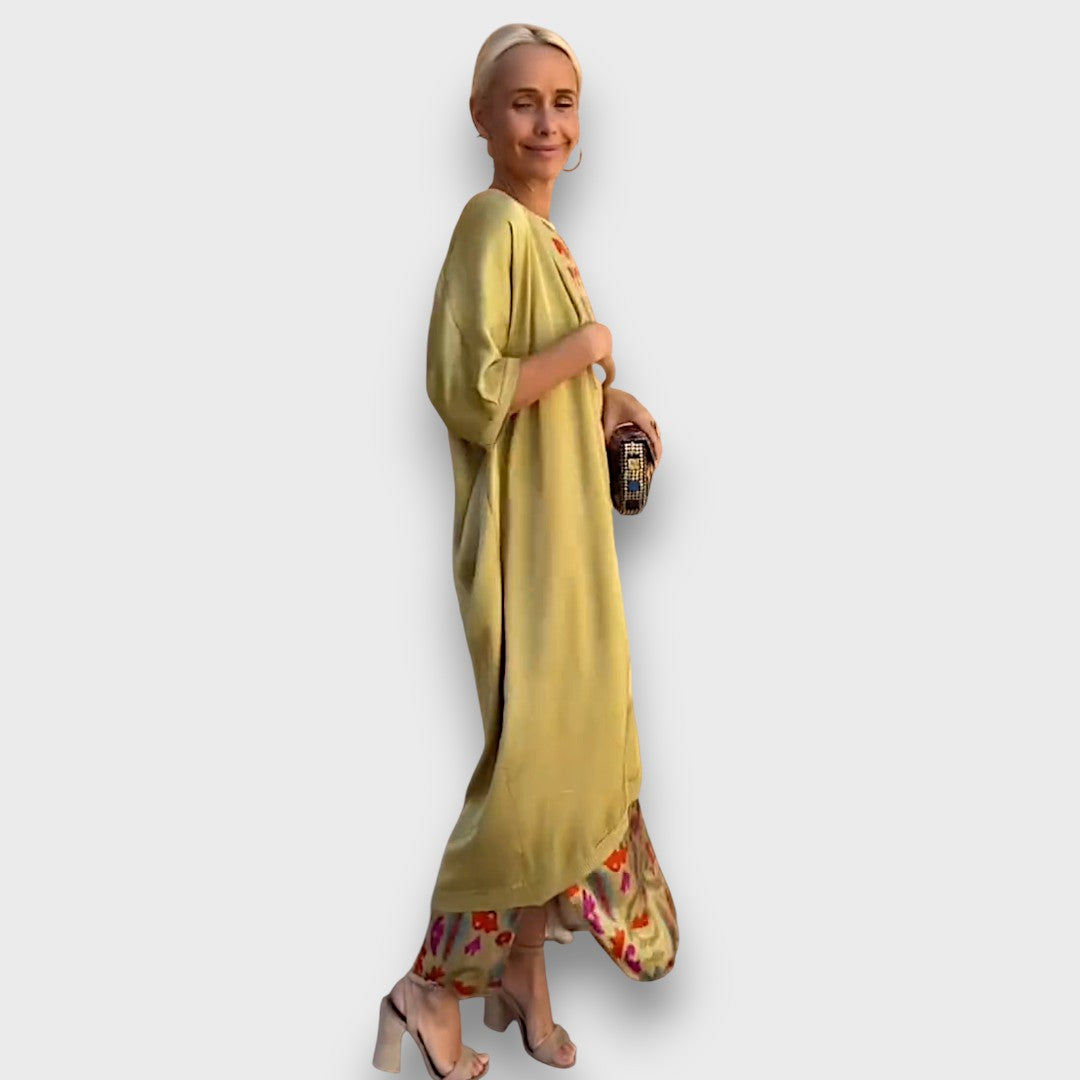 Elveria - Maxi suknelė su kardiganu" can be rewritten as "Elveria - Maxi Dress with Cardigan.
