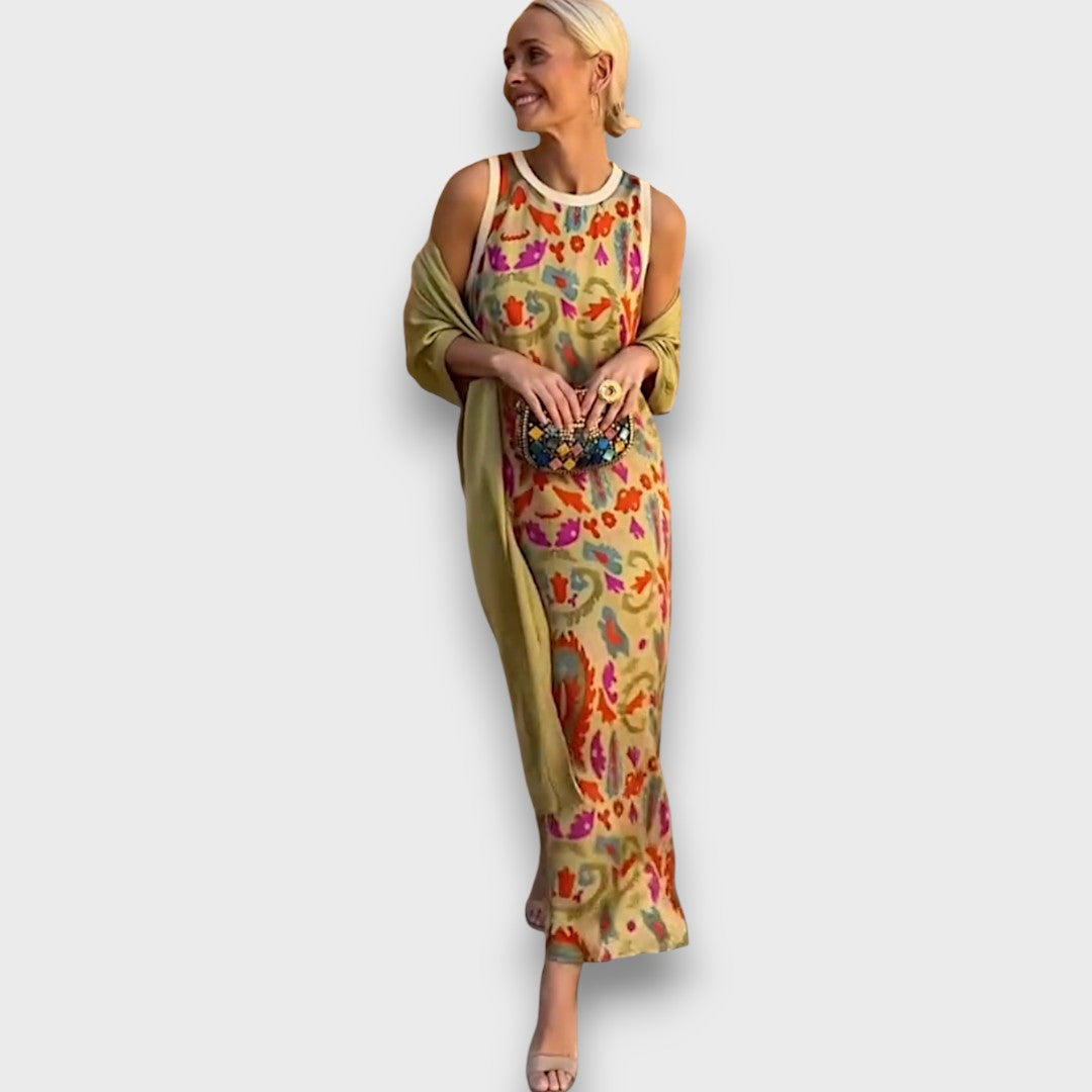 Elveria - Maxi suknelė su kardiganu" can be rewritten as "Elveria - Maxi Dress with Cardigan.